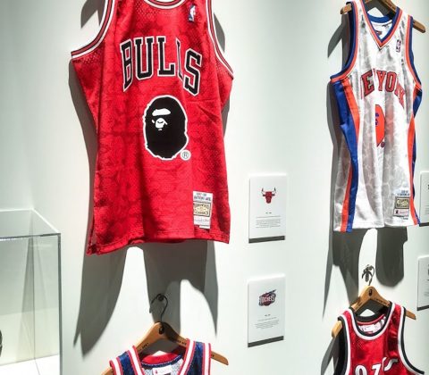 basketball jerseys hanging in a store