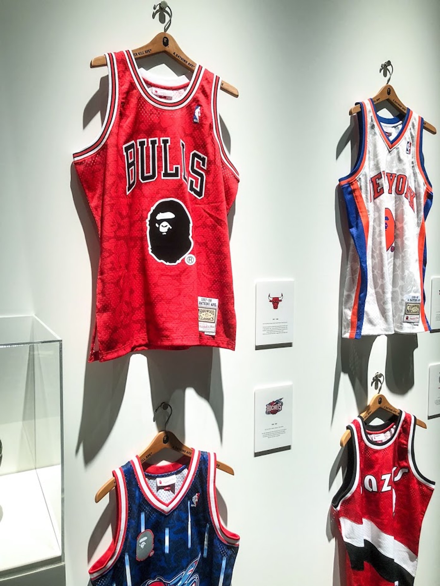 basketball jerseys hanging in a store